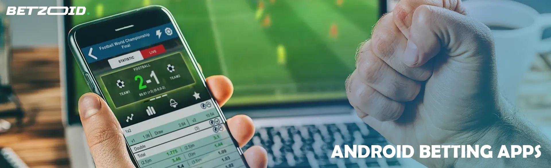 A person holds a smartphone with a sports betting app.