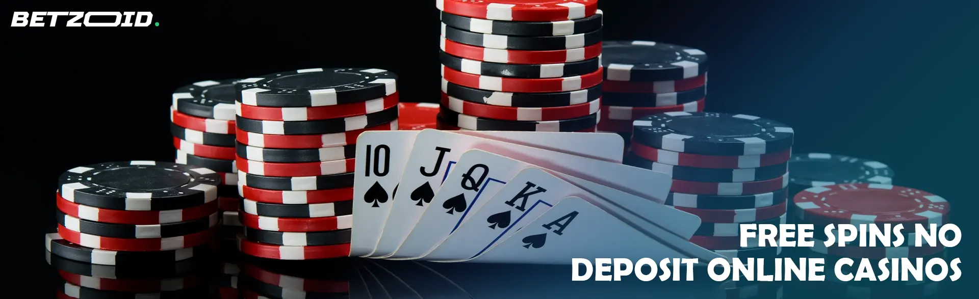 A pile of casino chips and cards on a dark background.