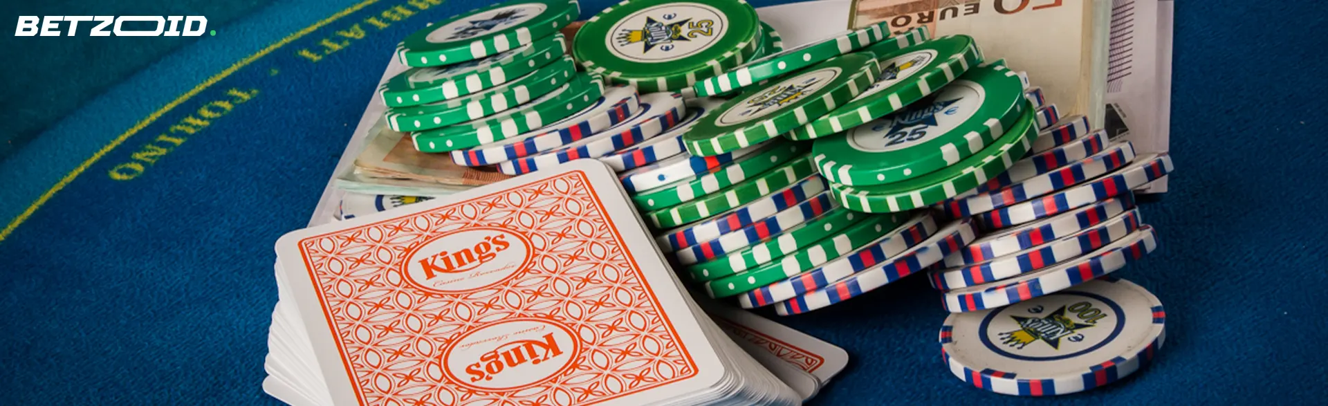 A pile of cards, money and casino chips.