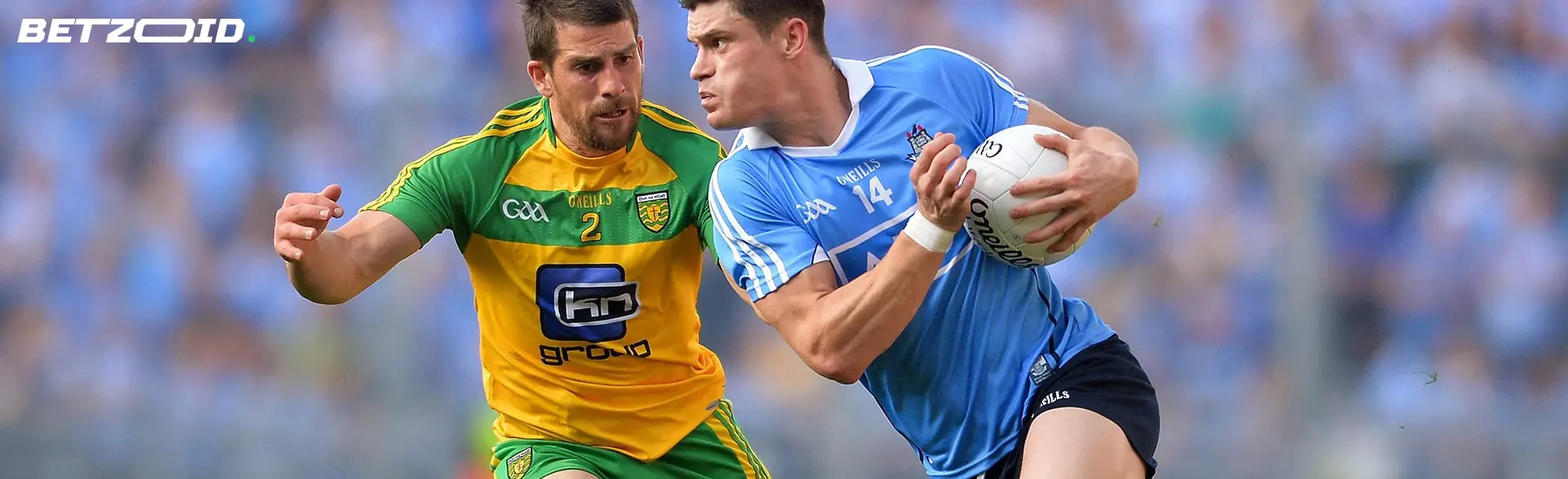 Gaelic football players fight for the ball.
