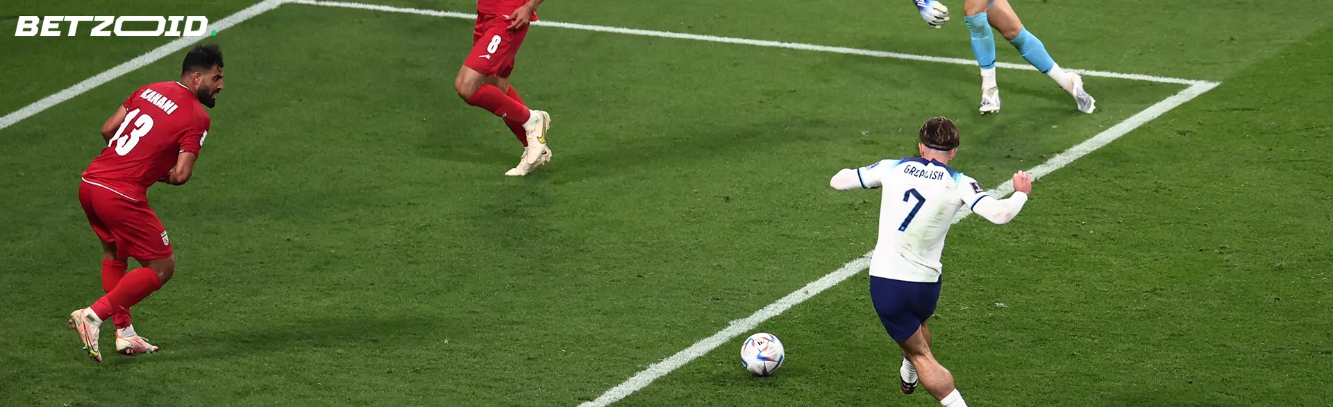 Football players on the field during a match.
