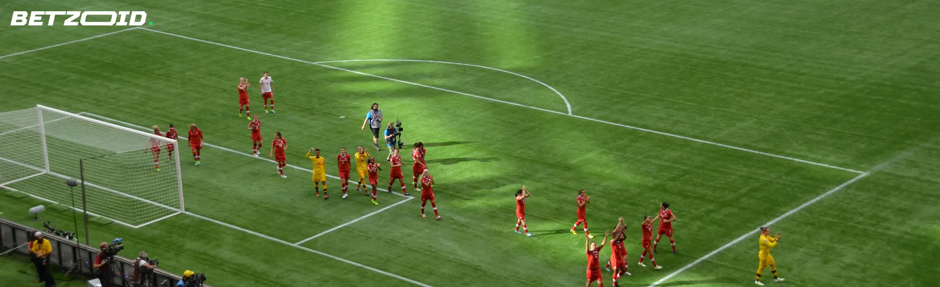 Football players on the field during a match.