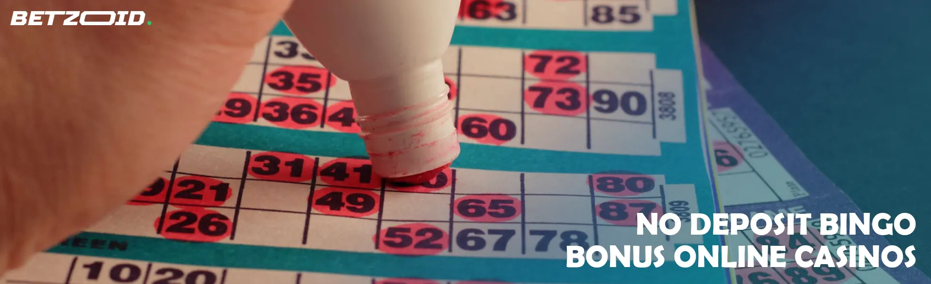 A bingo player marks the winning numbers on the card.