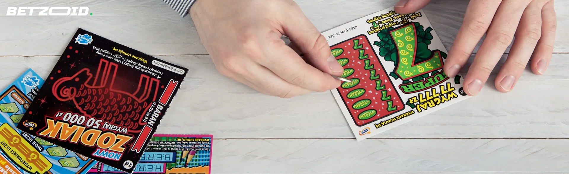 A person erases a scratch card.