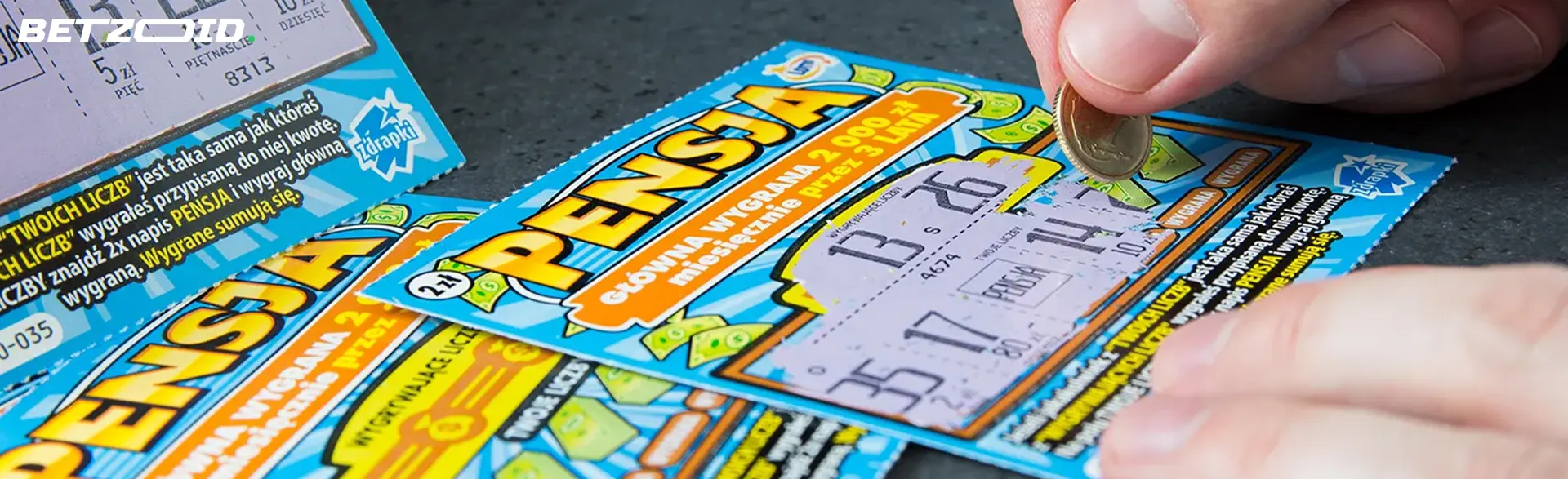 A person erases a scratch card.