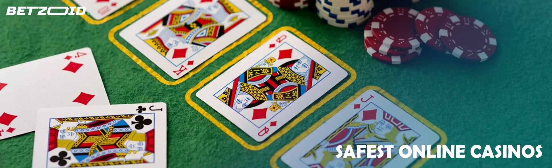 Cards next to casino chips on a green table.
