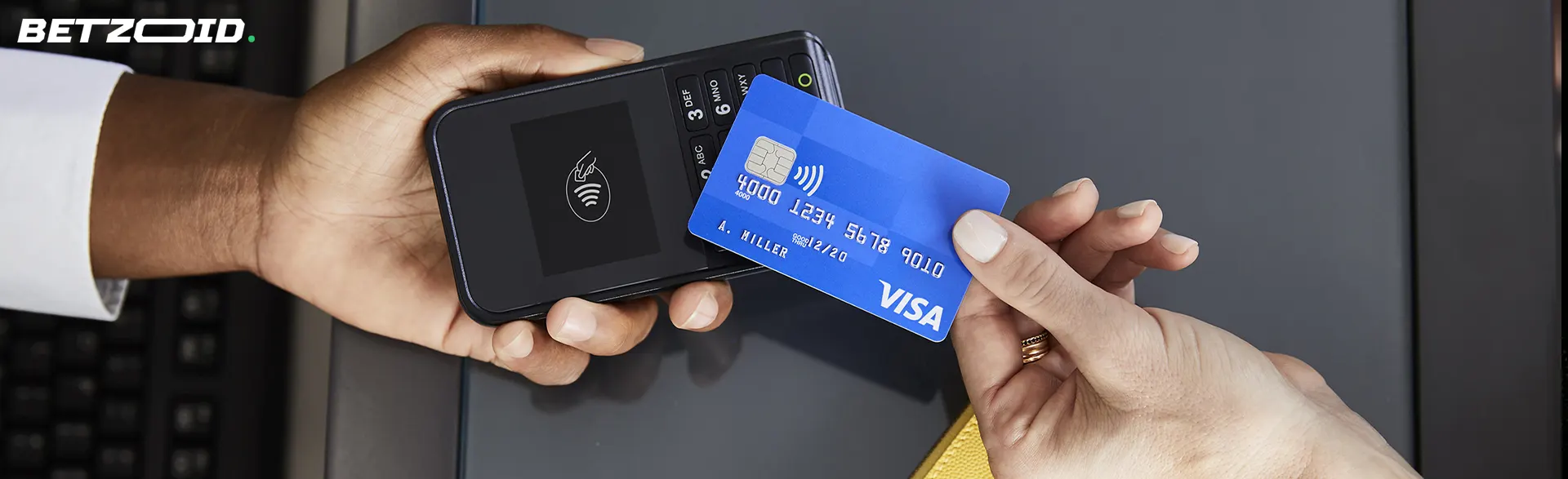 A person is trying to make a payment with a Visa card.