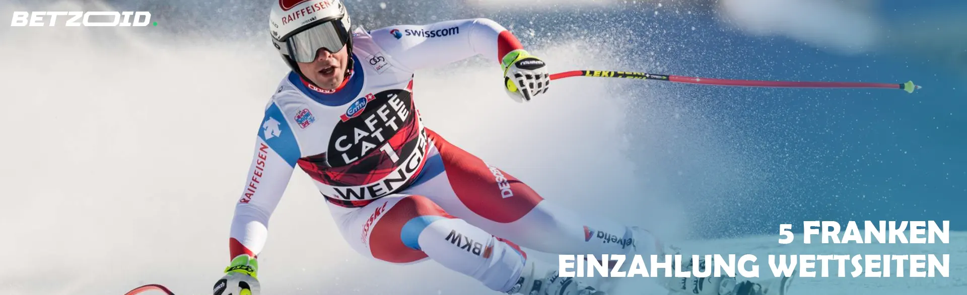 Ein Skifahrer fährt einen Hang hinunter.