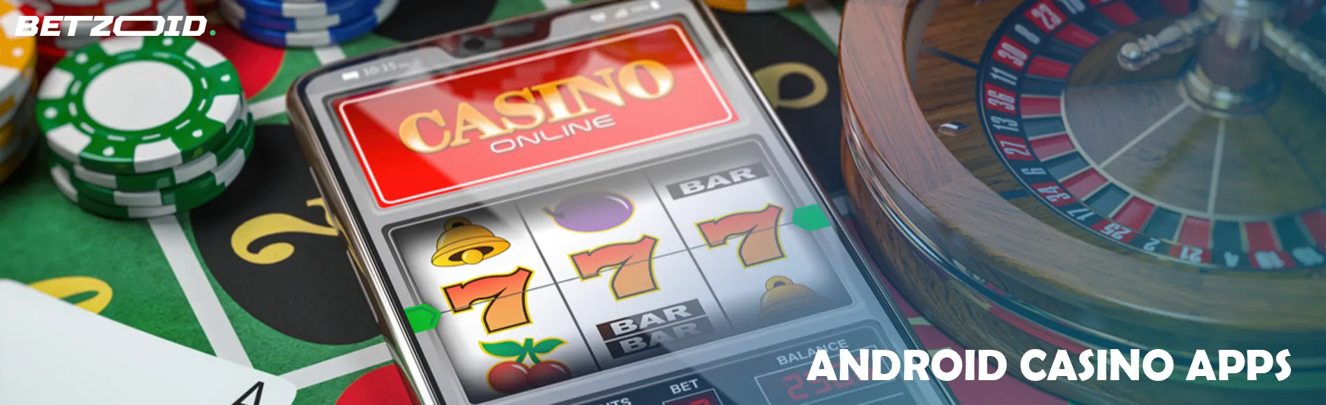 Smartphone umgeben von Casino-Chips, Karten und Roulette.