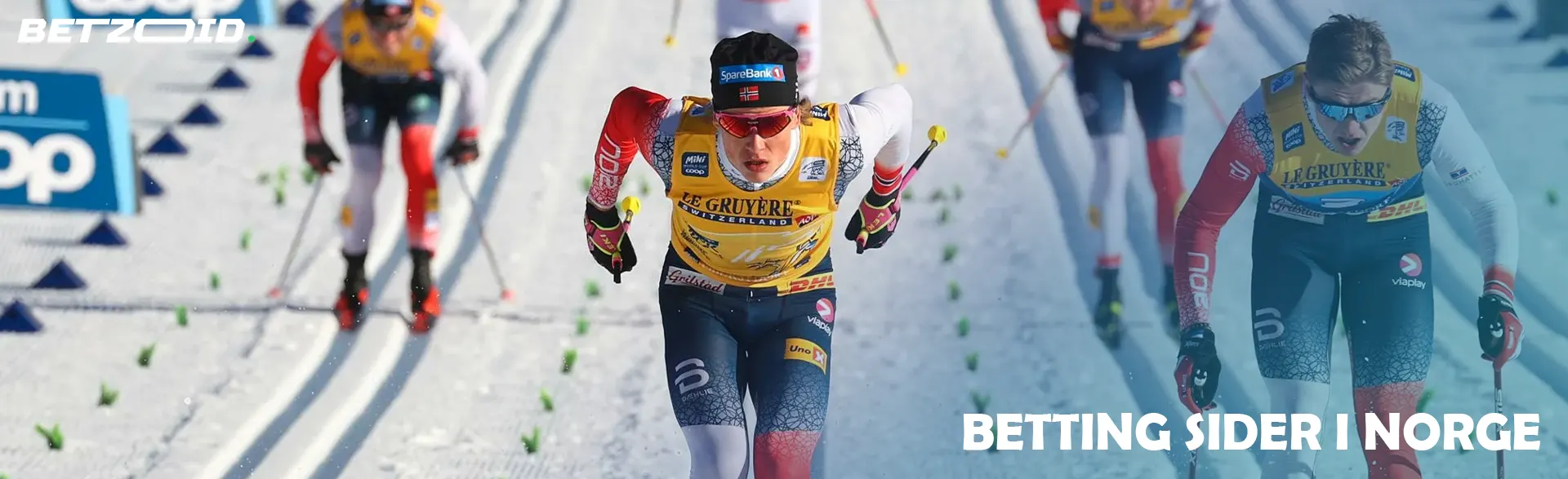 Skiløpere konkurrerer på en snøløype.