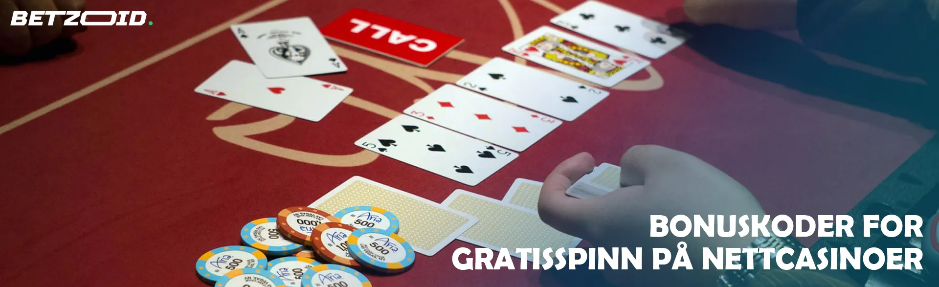 Spilleren legger ut kortene på kasinobordet.