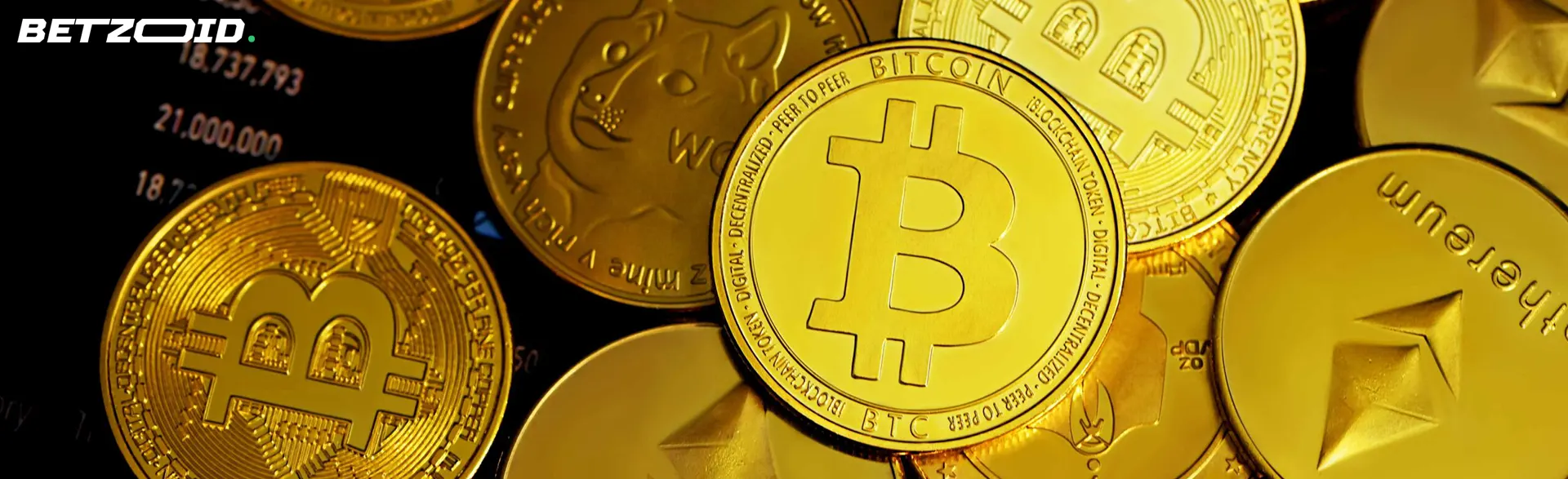 Goldmünzen verschiedener Kryptowährungen.