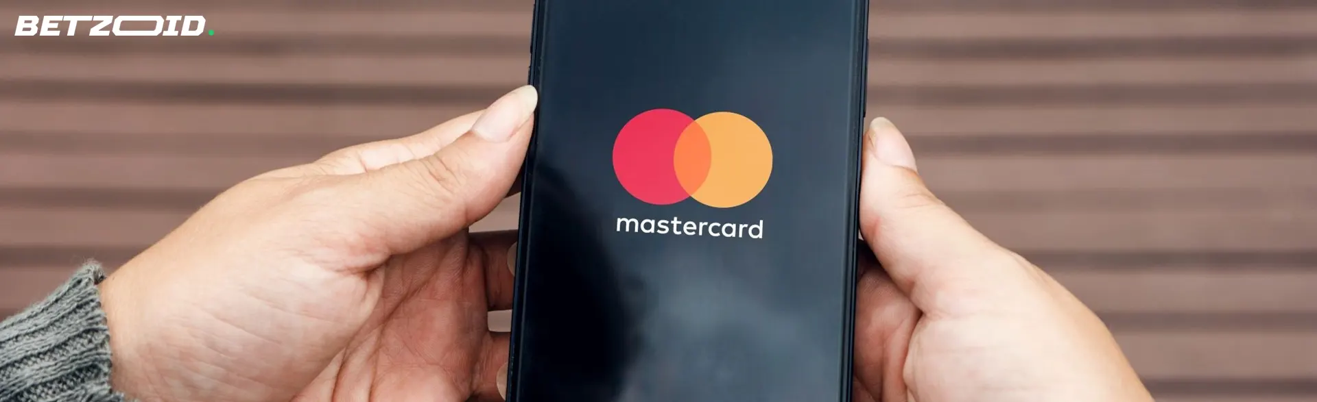Mastercard-logotypen på smarttelefonens skärm.