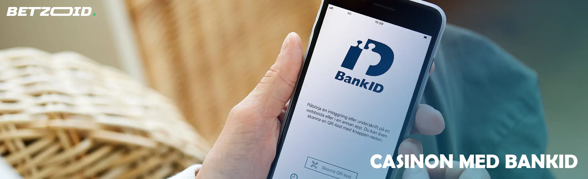 En person håller en smartphone med BankID-appen öppen.