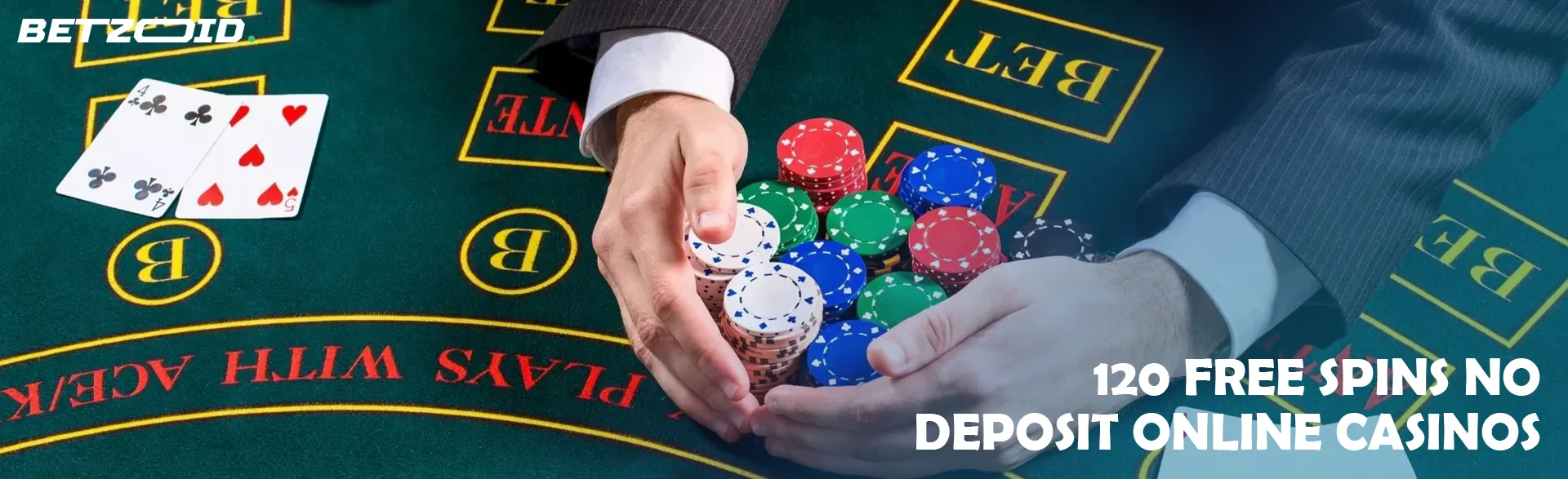A player holds chips on a casino table.