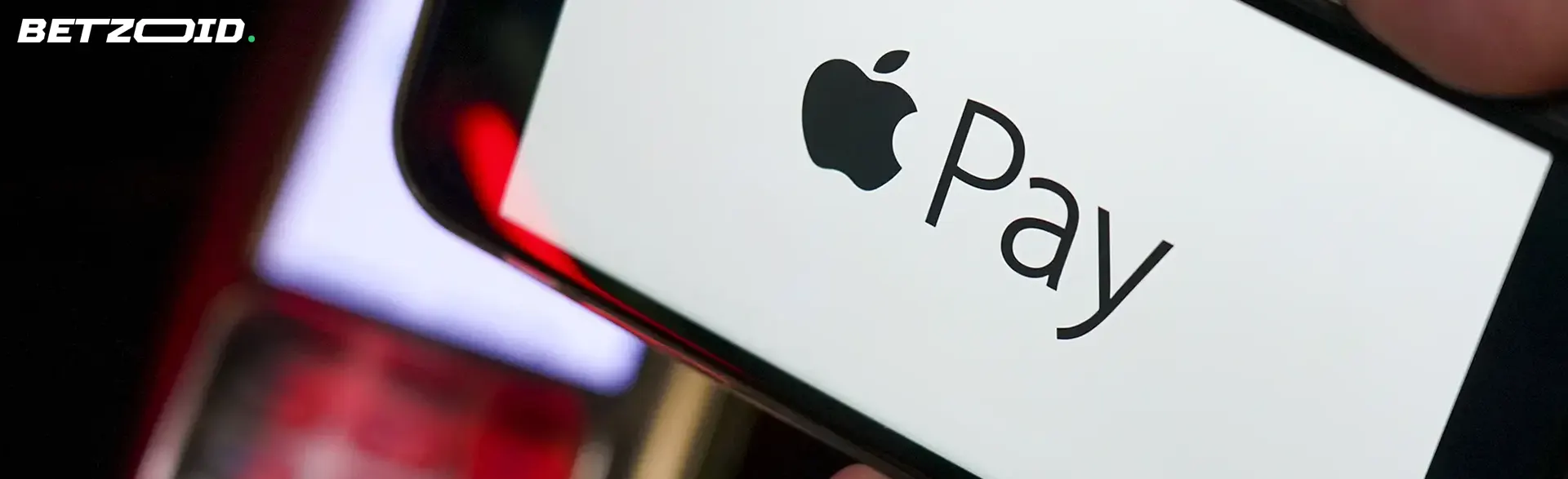 Smartphone with Apple Pay logo.