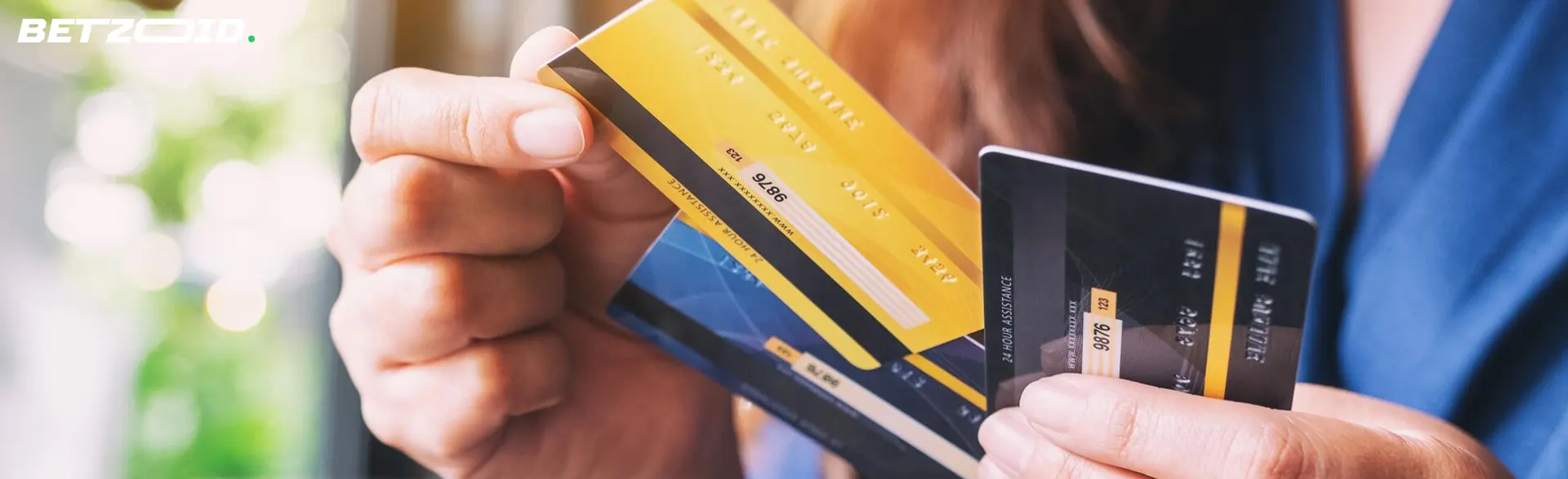 Man holding bank cards.