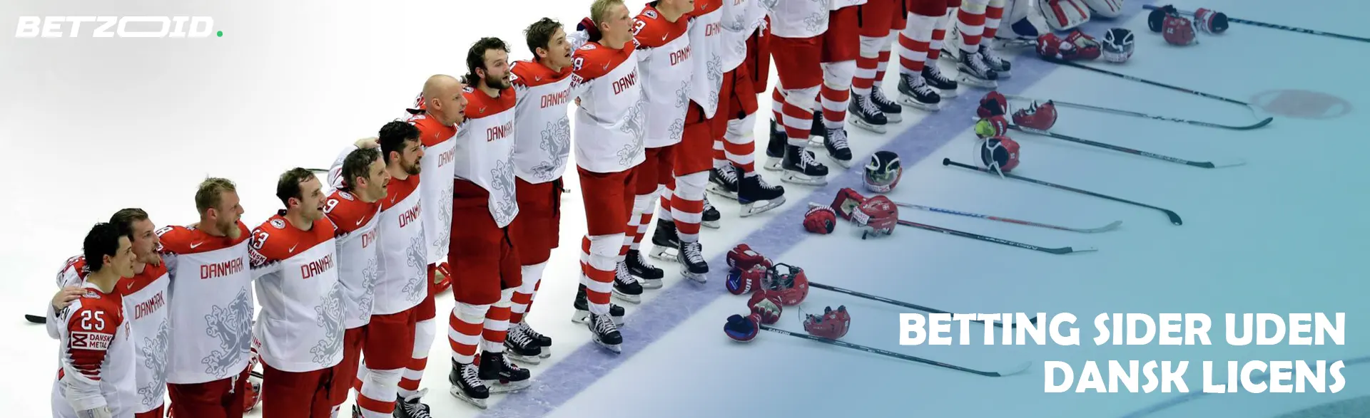 Ishockeyspillere står på række på isen.