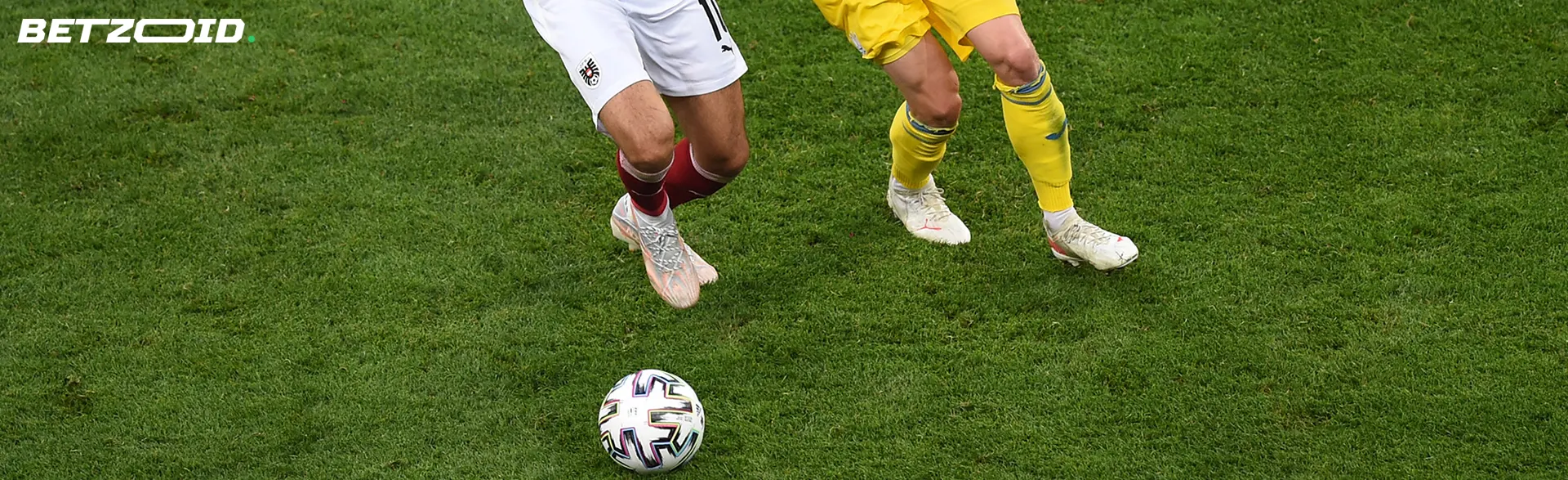 Football players fight for the ball during a game.