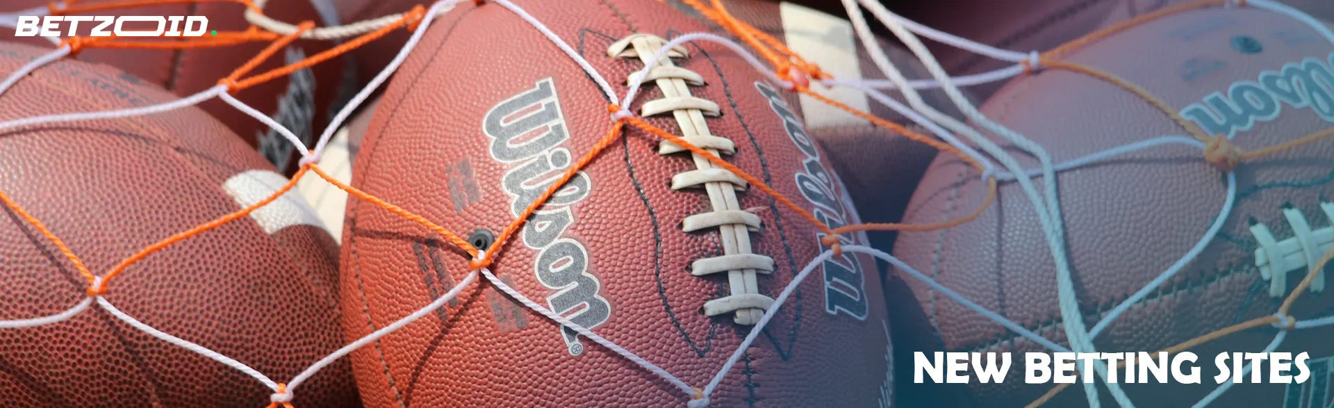 A pile of American football balls.