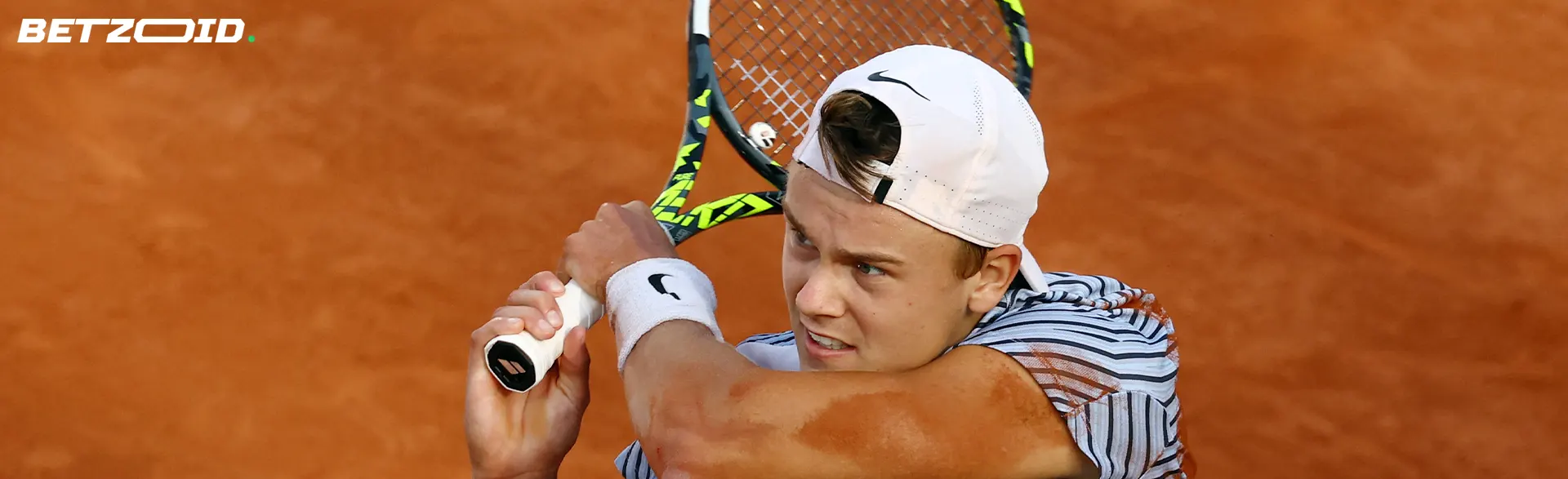 The tennis player swung his racket.