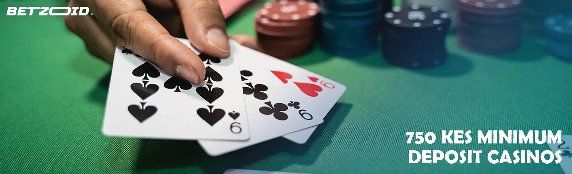 A player holds cards on a casino table.
