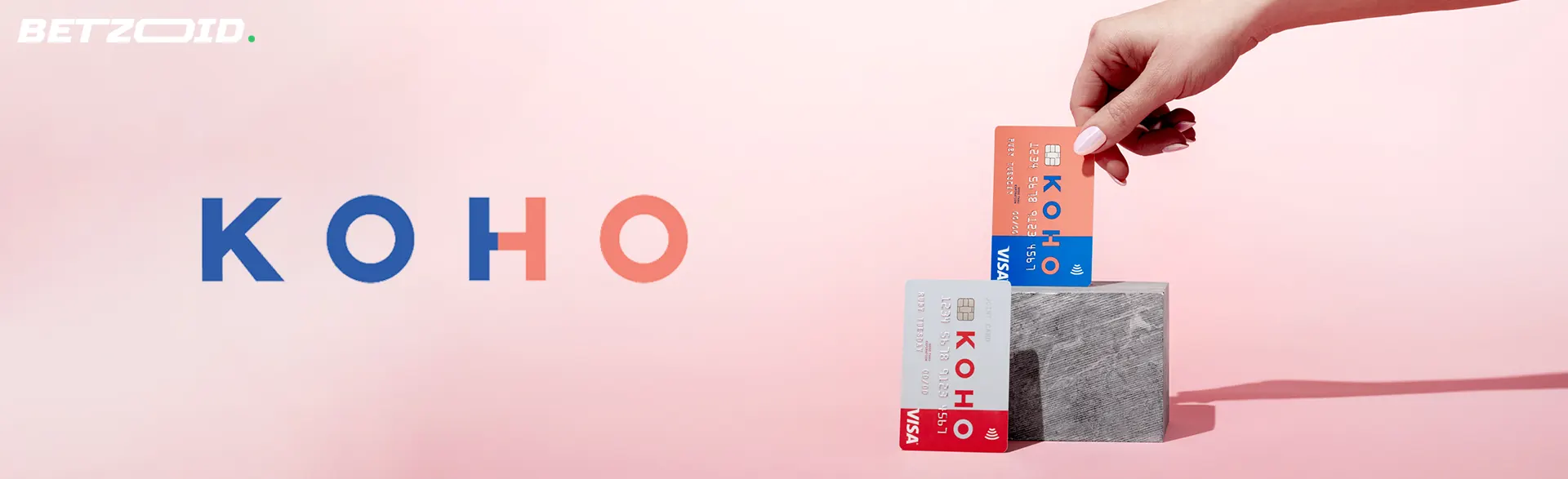 Koho logo next to Koho cards in a person's hand.