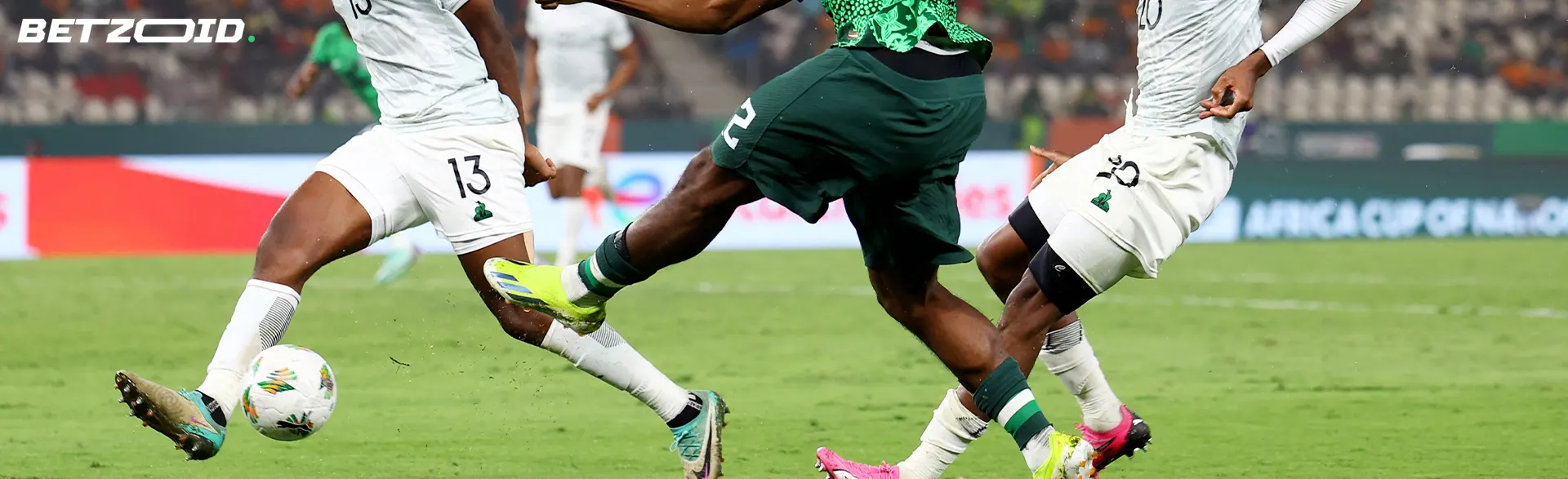 Football players fight for the ball during a game.