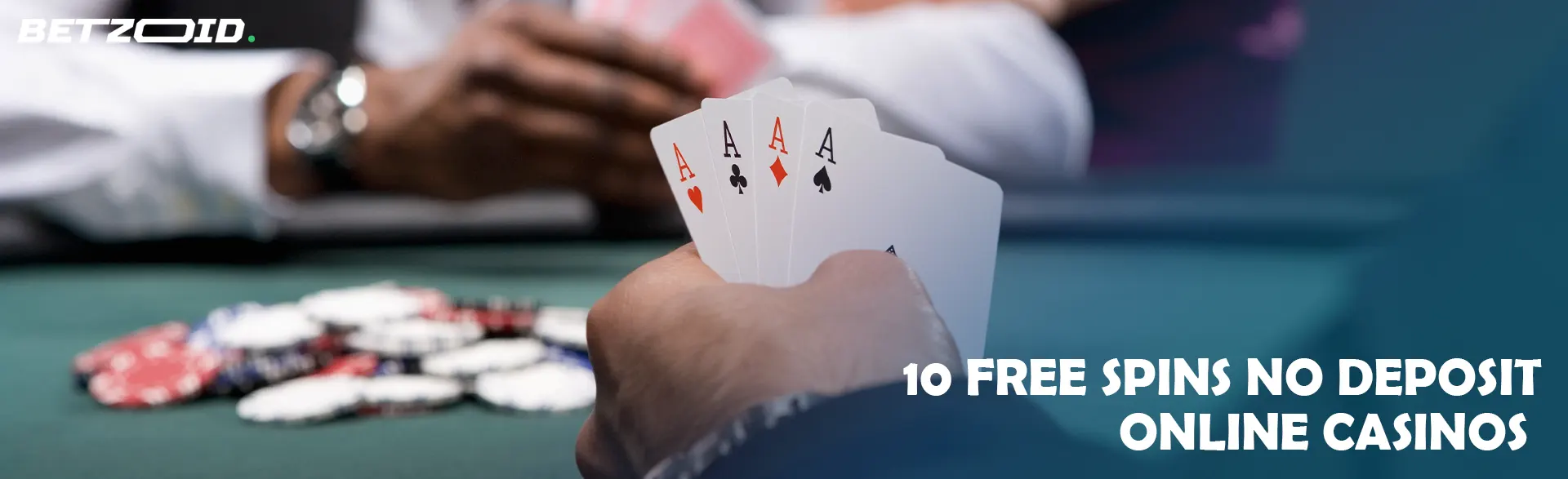 Player holding cards on casino table background.