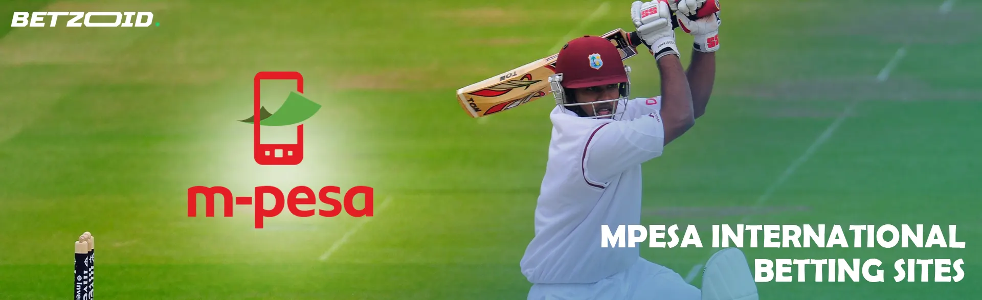 A cricketer tries to hit the ball next to the MPesa logo.