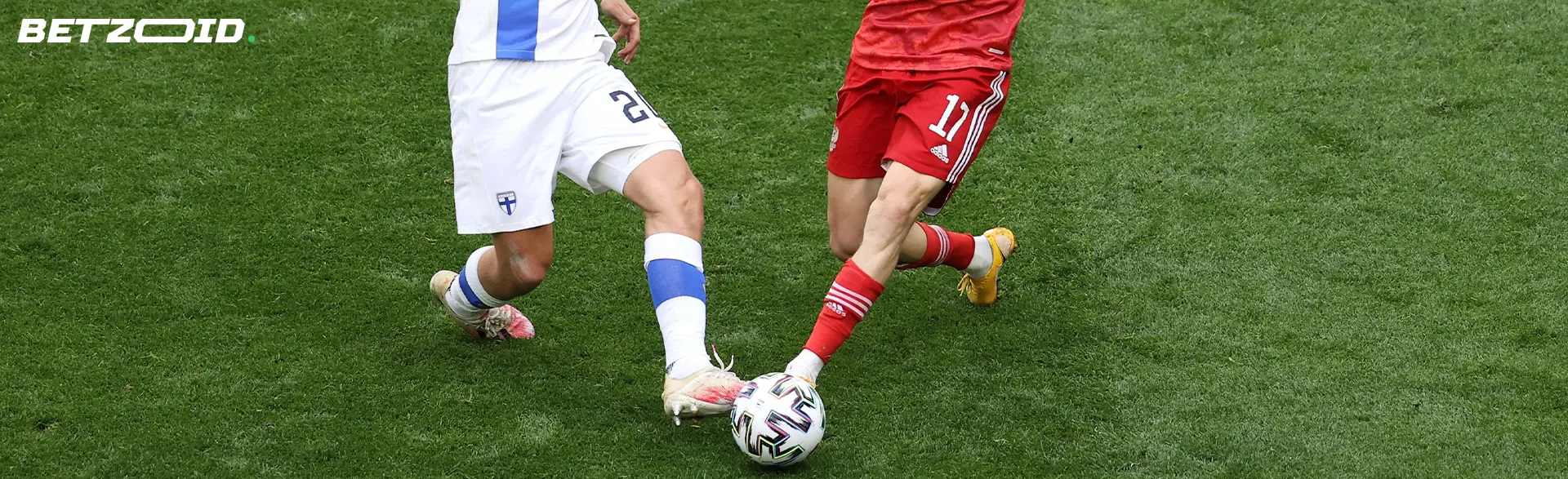 Football players fight for the ball during a game.