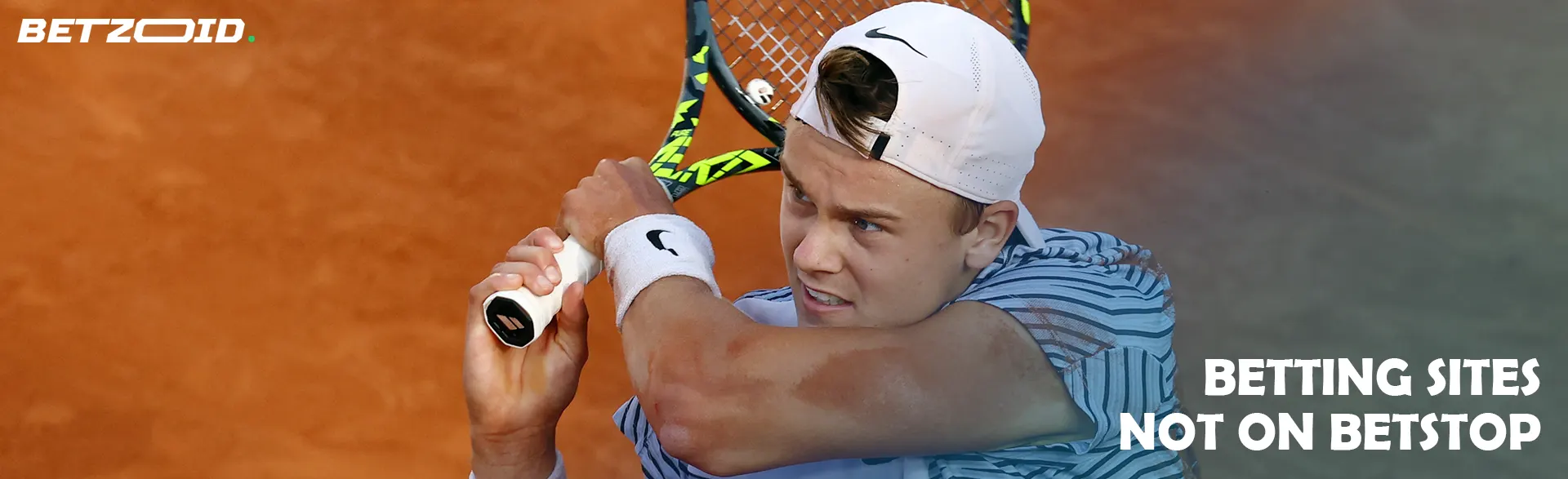 Tennis player with racket.