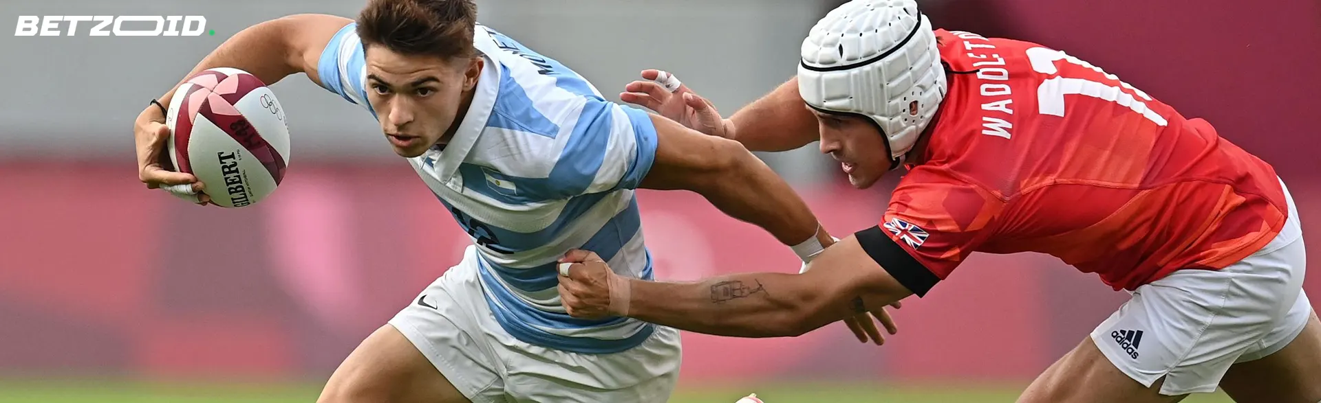 Rugby players fight for the ball during a game.