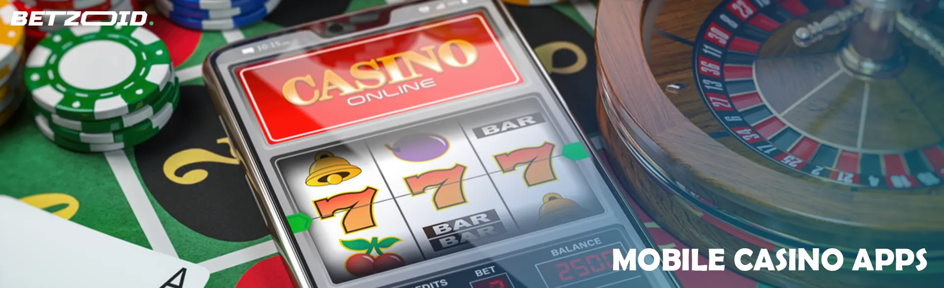 Smartphone surrounded by cards, chips and roulette wheel.