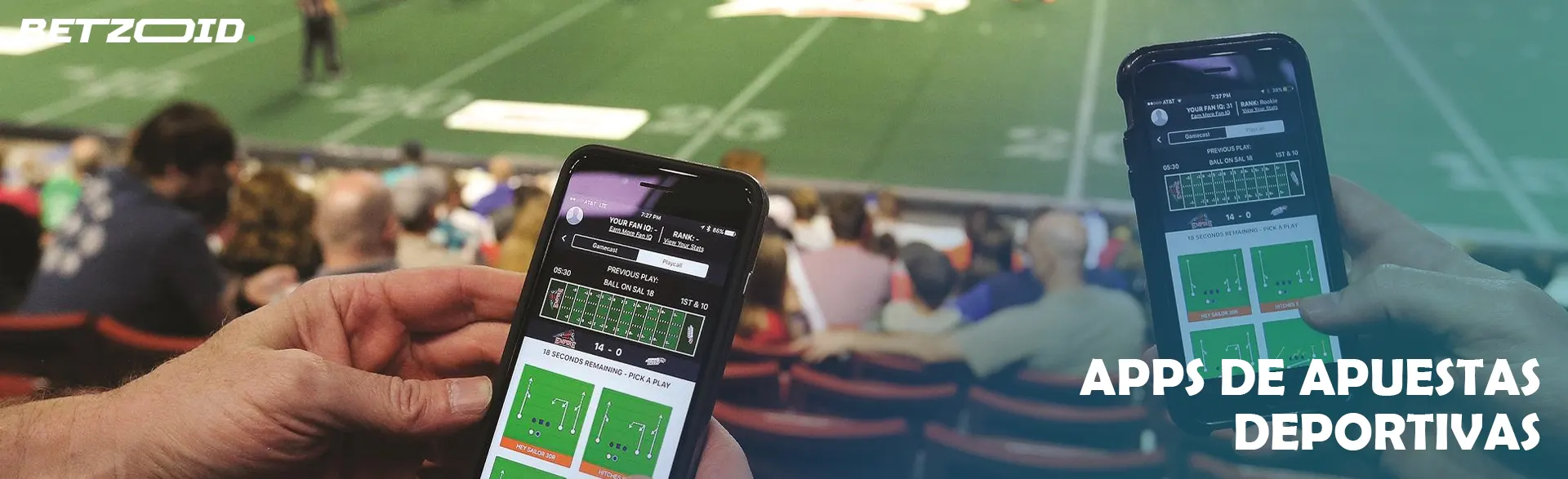 Teléfonos inteligentes con aplicaciones de apuestas en el fondo de las gradas.