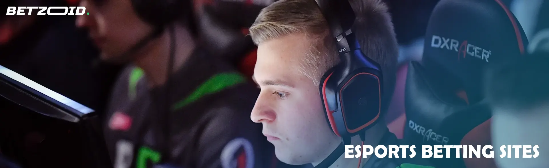 An esportsman in headphones at a computer.