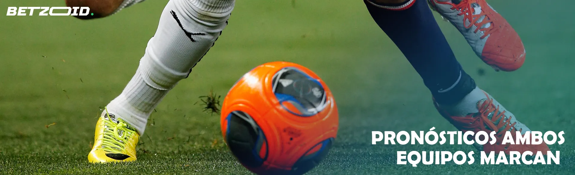 El balón a los pies de dos jugadores de fútbol.