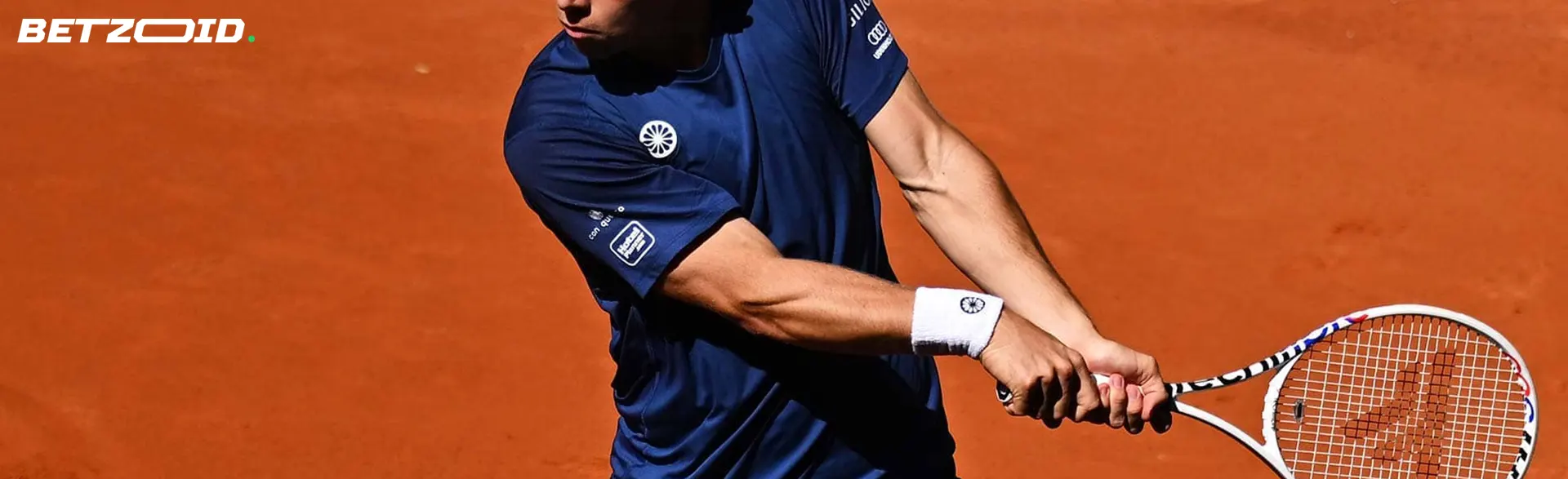 Tennis player with racket.