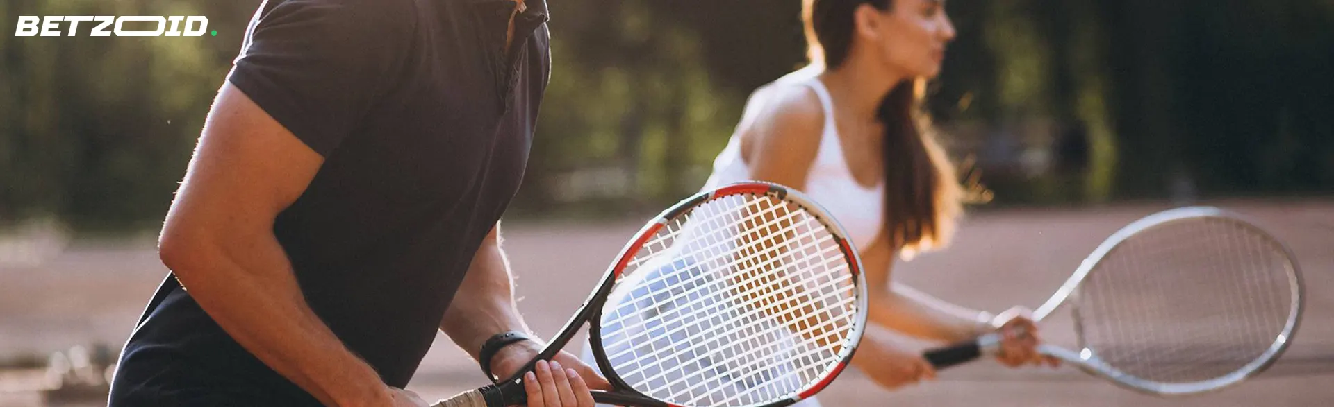 Tennis players with rackets in their hands.