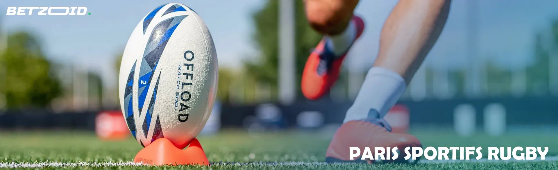 Un ballon de rugby sur un support avant un coup de pied.