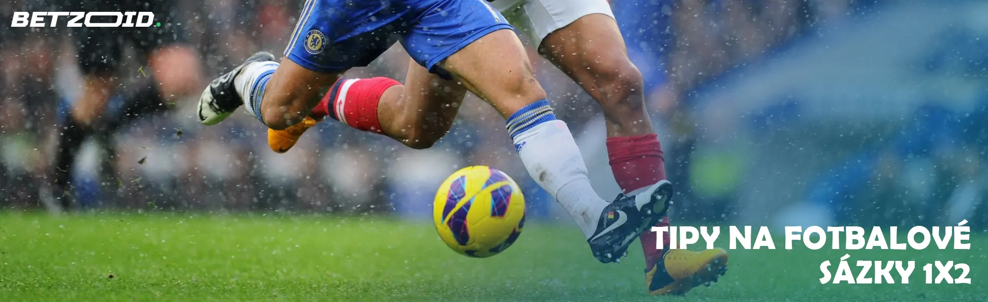 Fotbalisté během zápasu bojují o míč.