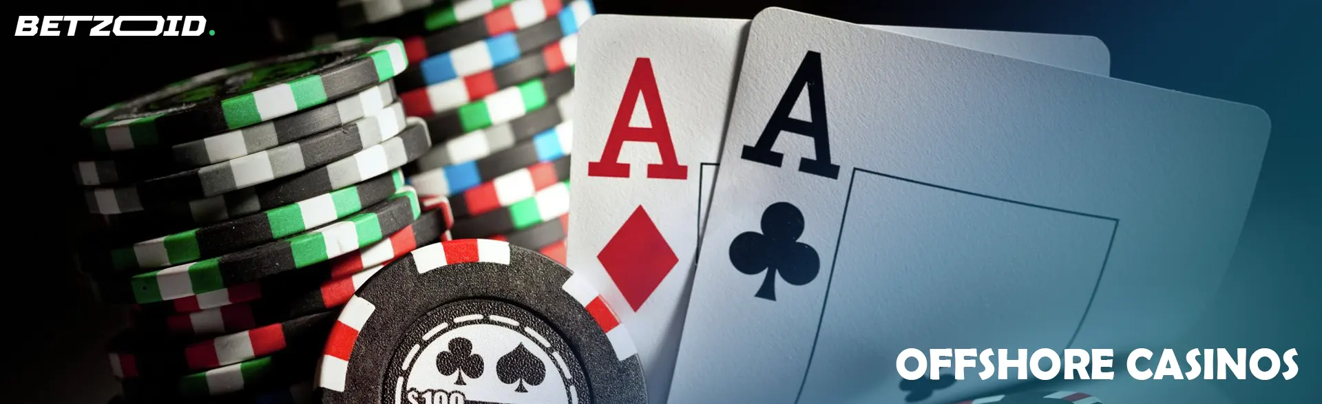 A pile of casino chips and cards on a dark background.