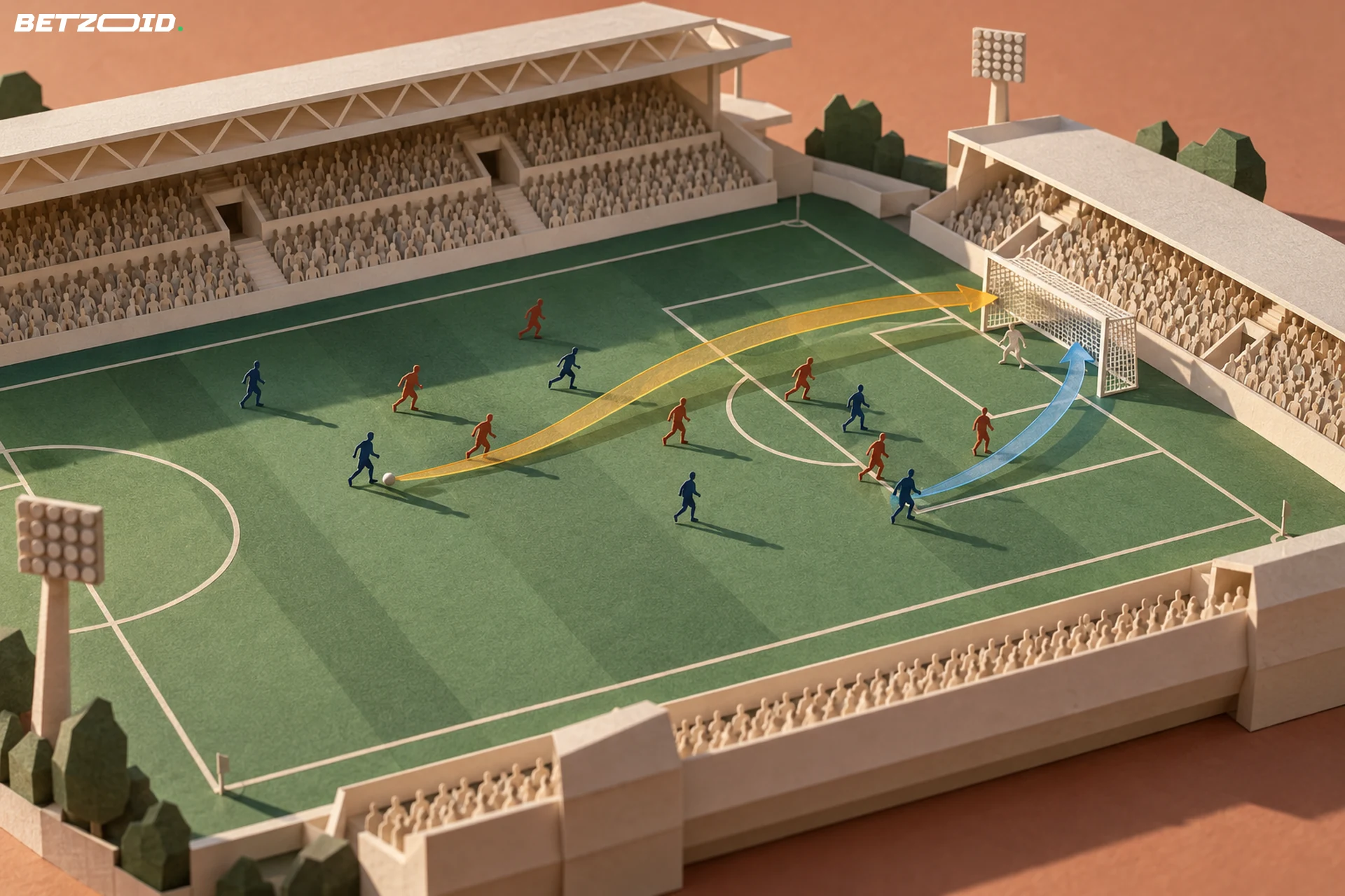 Maquete de estádio em papel com dois caminhos de ataque destacados em direção ao gol.